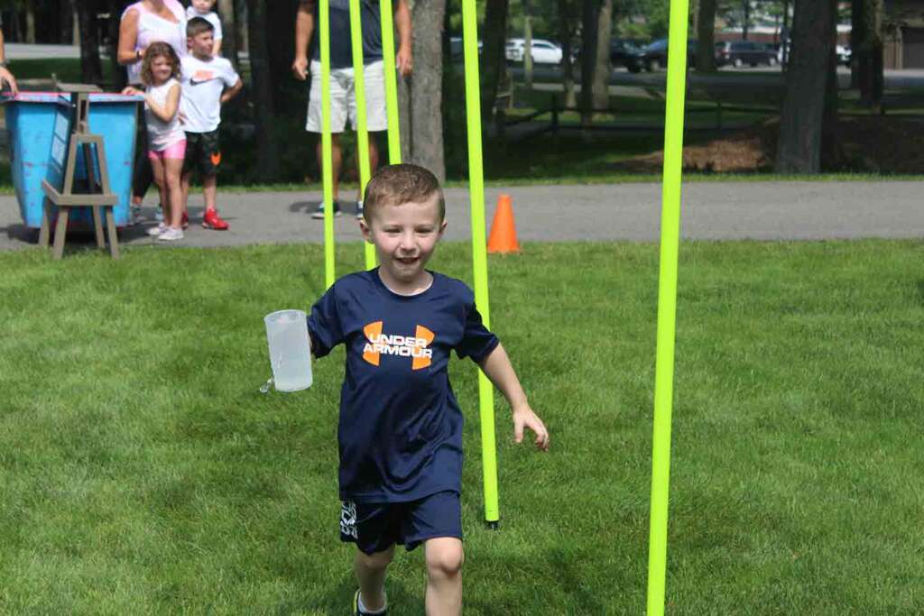 Photo of child holding a cup at the Woodloch Family Field Day Games