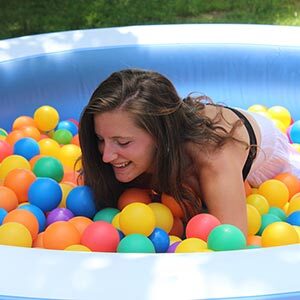 Girl in Small Pool filled with balls